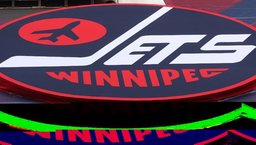 JOE BRYKSA / WINNIPEG FREE PRESSCrews work on finishing touches for the 2016 Heritage Classic at Investors Group Field in Winnipeg Tuesday- including a massive Winnipeg Jets logo  -Oct 18, 2016 -(See Jeffs story)