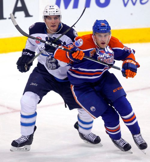 BORIS MINKEVICH / WINNIPEG FREE PRESS
Manitoba Moose vs. Bakersfield Condors at MTS Centre, Winnipeg. Moose #42 Peter Stoykewych, left, battles with Condors #36 Patrick Russell, right. Oct. 18, 2016