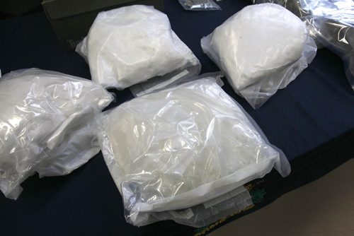 JOE BRYKSA / WINNIPEG FREE PRESSThree police services from Manitoba displayed seized items from project Derringer in Brandon, Manitoba Oct 12-15, 2016- Items seized included firearms, cash , vehicles , and drugs- On display at RCMP D Division headquarters 3.15 kg cocaine (Rear three bags) and 1.05 kg Methamphetamine,( Front)  -Oct 19, 2016 -(See Carol Sanders story)