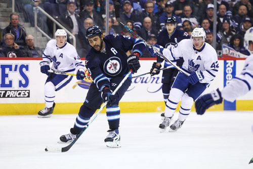 MIKE DEAL / WINNIPEG FREE PRESS
Winnipeg Jets' Dustin Byfuglien (33) with the puck during the game against the Toronto Maple Leafs at the MTS Centre Wednesday evening. 
161019
Wednesday, October 19, 2016