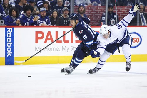 MIKE DEAL / WINNIPEG FREE PRESS

Winnipeg Jets' Shawn Matthias (16) on a breakaway is called for holding Toronto Maple Leafs' Auston Matthews (34) during the game at the MTS Centre Wednesday evening. 

161019
Wednesday, October 19, 2016