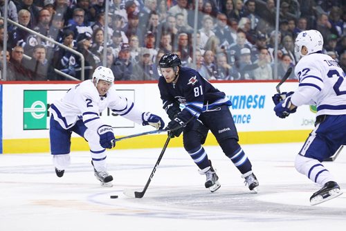 MIKE DEAL / WINNIPEG FREE PRESS

Winnipeg Jets' Kyle Connor (81) is stick checked by Toronto Maple Leafs' Matt Hunwick (2) during the game at the MTS Centre Wednesday evening. 

161019
Wednesday, October 19, 2016