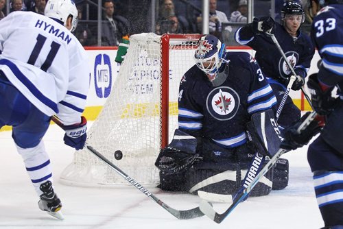 MIKE DEAL / WINNIPEG FREE PRESS

Winnipeg Jets' goaltender Michael Hutchinson (34) stops a shot by Toronto Maple Leafs' Zach Hyman (11) during the game at the MTS Centre Wednesday evening.

161019
Wednesday, October 19, 2016