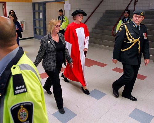 BORIS MINKEVICH / WINNIPEG FREE PRESS
University of Manitoba 49th Annual Fall Convocation for the conferring of Degrees and the awarding of Academic Honours held at Investors Group Athletic Centre. In red/white Her Honour the Honourable Janice Filmon, Lieutenant Governor of Manitoba, walks with her entourage towards the gym.  Oct. 20, 2016