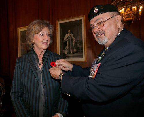 WAYNE GLOWACKI / WINNIPEG FREE PRESS



 Comrade Ronn Anderson, chairman, Poppy Campaign with the Royal Canadian Legion presented Lt. Gov. Janice Filmon on Friday with the first poppy of this years annual Royal Canadian Legion fundraiser. The legions Poppy Campaign officially begins Friday, Oct. 28. Poppies are worn to honour the more than 117,000 Canadians who have died in the service of their country throughout the world. see release. Oct. 21 2016