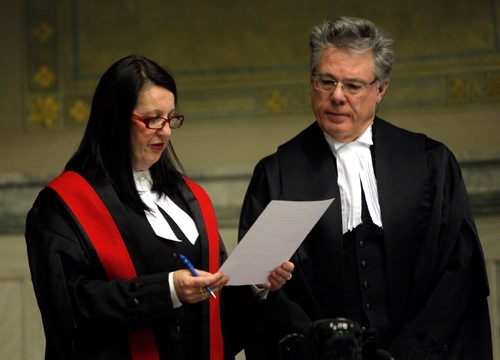BORIS MINKEVICH / WINNIPEG FREE PRESS
Swearing-in ceremony for The Honourable Chief Judge Margaret Wiebe, left, to the Provincial Court of Manitoba at the Winnipeg Law Courts Complex, 408 York Avenue. Here she does the oath of office and allegiance with The Honourable Mr. Richard J.F. Chartier, right, Chief Justice of Manitoba.  Oct. 21, 2016