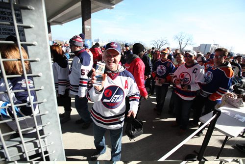 
RUTH BONNEVILLE / WINNIPEG FREE PRESS

Tom Heibert shows off his ticket tot he alumni game as he enters the south gates with hundreds of fans Saturday.   2016 Tim Hortons NHL Heritage Classic Alumni Game at Investors Group Stadium.


October 22, 2016