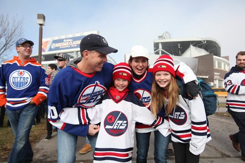 
RUTH BONNEVILLE / WINNIPEG FREE PRESS

The MacInness family, Dad-Doug, mom-Shannon, son Ben (9yrs) and daughter Abby (11yrs), show off their excitement outside the stadium prior to the start of the alumni game Saturday.  2016 Tim Hortons NHL Heritage Classic Alumni Game at Investors Group Stadium.


October 22, 2016