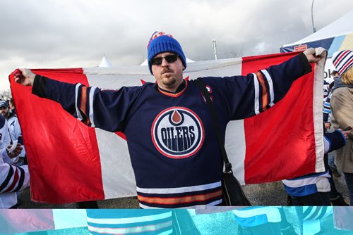 MIKE DEAL / WINNIPEG FREE PRESS
Andrew Lindsay wears a Canadian flag while wandering amongst the other hundreds of fans that gathered at the Spectator Plaza across the street from IGF field Sunday hours before the NHL game between the Winnipeg Jets and the Edmonton Oilers.
161023 - Sunday October 23, 2016