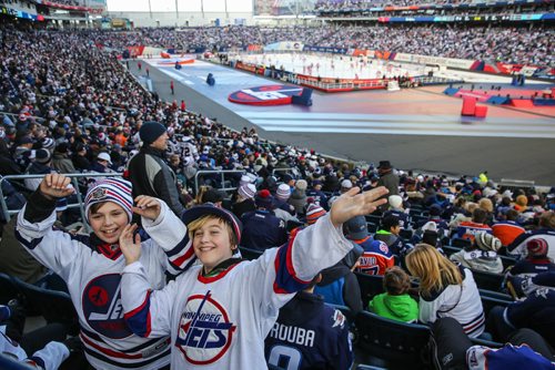 MIKE DEAL / WINNIPEG FREE PRESS
Kalen Barnett (left), 11, and Christian Thiessen (right), 11, cheer prior to the start of the NHL game between the Winnipeg Jets and the Edmonton Oilers at Investors Group Field.
161023 - Sunday October 23, 2016