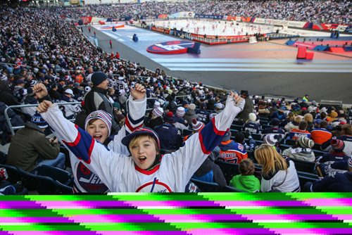 MIKE DEAL / WINNIPEG FREE PRESS
Kalen Barnett (left), 11, and Christian Thiessen (right), 11, cheer prior to the start of the NHL game between the Winnipeg Jets and the Edmonton Oilers at Investors Group Field.
161023 - Sunday October 23, 2016