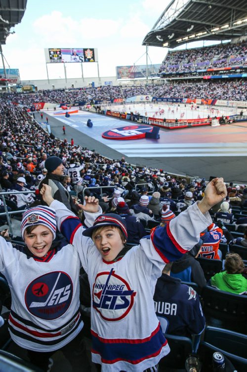 MIKE DEAL / WINNIPEG FREE PRESS
Kalen Barnett (left), 11, and Christian Thiessen (right), 11, cheer prior to the start of the NHL game between the Winnipeg Jets and the Edmonton Oilers at Investors Group Field.
161023 - Sunday October 23, 2016