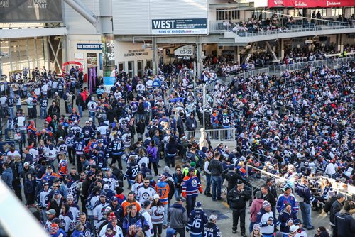 MIKE DEAL / WINNIPEG FREE PRESS
Fans make their way around the concourse prior to the start of the NHL game between the Winnipeg Jets and the Edmonton Oilers at Investors Group Field.
161023 - Sunday October 23, 2016