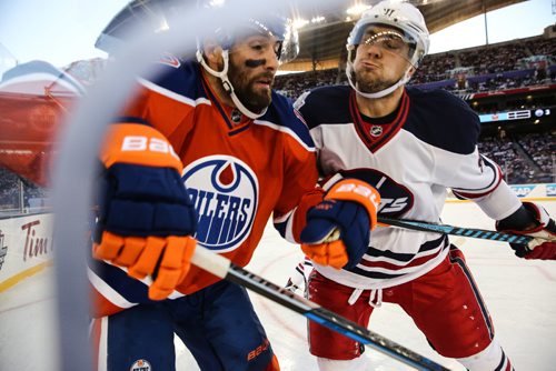 MIKE DEAL / WINNIPEG FREE PRESS
The Winnipeg Jets' Alexander Burmistrov (91) puts Edmonton Oilers' Patrick Maroon (19) into the boards during the NHL game at Investors Group Field.
161023 - Sunday October 23, 2016