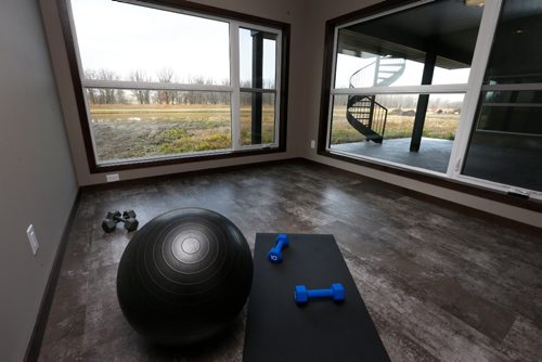 WAYNE GLOWACKI / WINNIPEG FREE PRESS


Homes.   Exercise area in the lower level at 224 Deer Pointe Drive in Deer Pointe Park in Headingley. 
¤¤¤The realator is  Parkhill Homes Lori Thorsteinson.  Todd Lewys story Oct. 24 2016