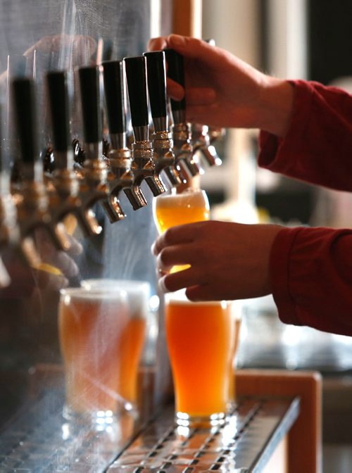 WAYNE GLOWACKI / WINNIPEG FREE PRESS
Restaurant Review of the PEG Beer Co. on Pacific Ave. Colin Enquist, Manager at the beer tap. Alison Gillmor story Oct. 25 2016