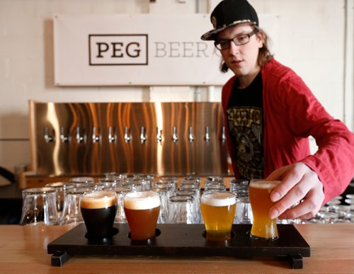 WAYNE GLOWACKI / WINNIPEG FREE PRESS


Restaurant Review of  the PEG Beer Co. on Pacific Ave.  Colin Enquist, Manager with "flight" Peg Beer selection. . Alison Gillmor story Oct. 25 2016

