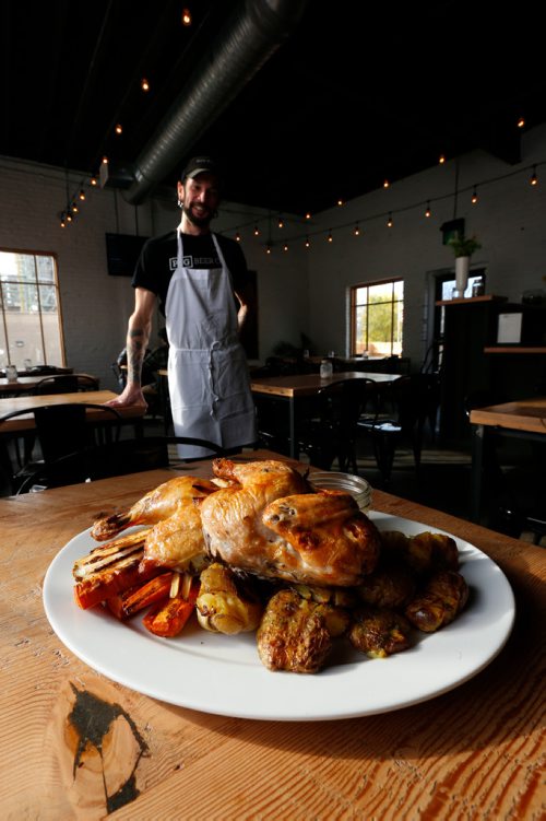 WAYNE GLOWACKI / WINNIPEG FREE PRESS


Restaurant Review of  the PEG Beer Co. on Pacific Ave.  Chef Aron Epp with Whole Roasted Chicken platter.. Alison Gillmor story Oct. 25 2016
