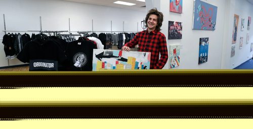 WAYNE GLOWACKI / WINNIPEG FREE PRESS



   Artist Josiah Koppanyi owner of Josiah Galleries with his paintings shares the space with Eric Olek's Friday Knights Clothing & Accessories at left. CentreVenture-assisted this shared pop-up retail location on Graham Avenue. Murray McNeill story Oct. 25 2016
