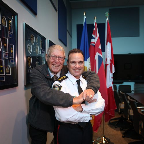 
RUTH BONNEVILLE / WINNIPEG FREE PRESS

New WPS Chief Danny Smyth gets a warm hug from his proud dad, Stan Smyth who also was a police officer. in the boardroom at the Police Headquarters Wednesday.  
See Gord Sinclair column. 
October 26, 2016