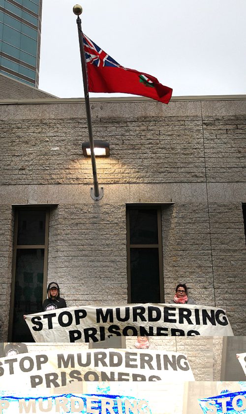 PHIL HOSSACK / WINNIPEG FREE PRESS -  Protestors bear a banner a Rally held Wednesday afternoon in front of the Remand Centre on Kennedy Street. See Carol Sanders story.   October 26, 2016