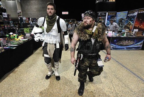 PHIL HOSSACK / WINNIPEG FREE PRESS - Serious about their fantasies, Jessie McLaughlin plays a Storm Trooper and John Gano a wasteland survivor (right) as they stroll the alleyways at the convention centre. Comic Con brings out the best from across the universe at the Convention Centre this weekend. See Randall King's story.  October 28, 2016