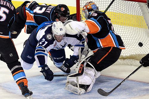 PHIL HOSSACK / WINNIPEG FREE PRESS - Mb Moose winger #21 Quinton Howden flies through San Diego Gull netminder Kevin Boyle's crease after scooping the puck into the net Friday at the MTS Center. Gulls #5 Nate Guenin and Tyler Morely follow up too late. See story. October 28, 2016