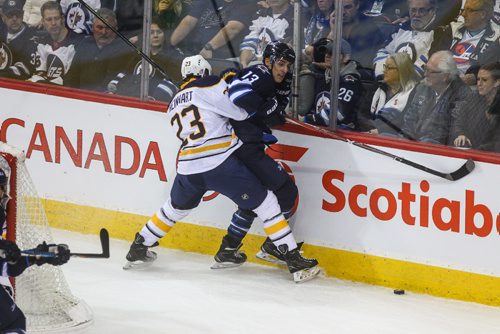 MIKE DEAL / WINNIPEG FREE PRESS
The Winnipeg Jets' Brandon Tanev (13) is checked against the boards by Buffalo Sabres' forward Sam Reinhart (#23) during NHL game action Sunday afternoon at the MTS Centre.
161030 - Sunday October 30, 2016