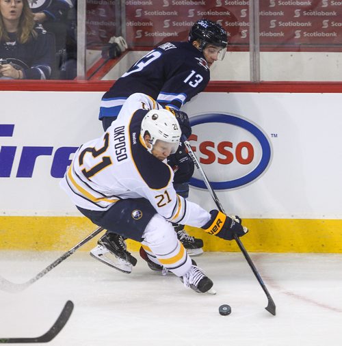 MIKE DEAL / WINNIPEG FREE PRESS
The Winnipeg Jets' Brandon Tanev (13) is forced off the puck by Buffalo Sabres' forward Kyle Okposo (#21) during NHL game action Sunday afternoon at the MTS Centre.
161030 - Sunday October 30, 2016