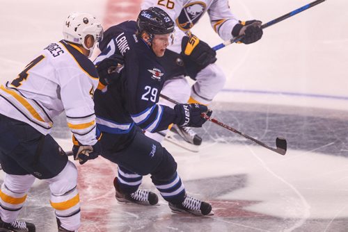 MIKE DEAL / WINNIPEG FREE PRESS
The Winnipeg Jets' Patrik Laine (29) muscles past Buffalo Sabres' defenceman Josh Gorges (#4) during the Sunday afternoon game at the MTS Centre.
161030 - Sunday October 30, 2016
