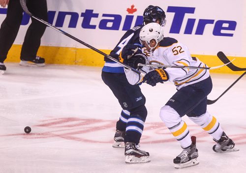 MIKE DEAL / WINNIPEG FREE PRESS
The Winnipeg Jets' Josh Morrissey (44) slows down Buffalo Sabres' forward Hudson Fasching (#52) during NHL action Sunday afternoon at the MTS Centre.
161030 - Sunday October 30, 2016