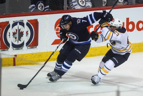 MIKE DEAL / WINNIPEG FREE PRESS
The Winnipeg Jets' Ben Chiarot (7) keeps Buffalo Sabres' forward Tyler Ennis (#63) off the puck during NHL game action Sunday afternoon at the MTS Centre.
161030 - Sunday October 30, 2016