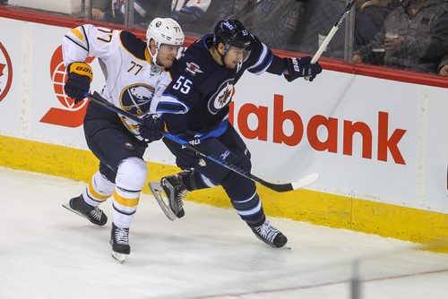 MIKE DEAL / WINNIPEG FREE PRESS
The Winnipeg Jets' Mark Scheifele (55) goes for the puck while Buffalo Sabres' defenceman Dmitry Kulikov (#77) tries to slow him down during NHL game action Sunday afternoon at the MTS Centre.
161030 - Sunday October 30, 2016