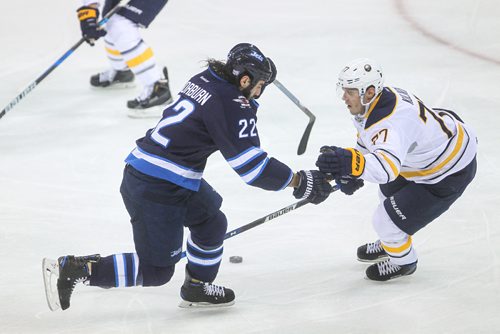 MIKE DEAL / WINNIPEG FREE PRESS
The Winnipeg Jets' Chris Thorburn (22) tries to maneuver around Buffalo Sabres' defenceman Dmitry Kulikov (#77) during NHL action Sunday afternoon at the MTS Centre.
161030 - Sunday October 30, 2016
