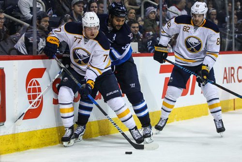 MIKE DEAL / WINNIPEG FREE PRESS
The Winnipeg Jets' Dustin Byfuglien (33) is forced off the puck by Buffalo Sabres' defenceman Dmitry Kulikov (#77) during NHL game action Sunday afternoon at the MTS Centre.
161030 - Sunday October 30, 2016