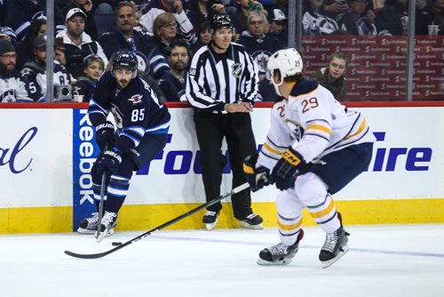 MIKE DEAL / WINNIPEG FREE PRESS
The Winnipeg Jets' Mathieu Perreault (85) takes the puck over the blue line during play against the Buffalo Sabres' defenceman Jake McCabe (#29) Sunday afternoon at the MTS Centre.
161030 - Sunday October 30, 2016