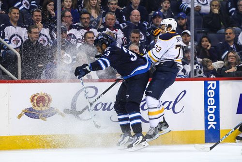 MIKE DEAL / WINNIPEG FREE PRESS
The Winnipeg Jets' Dustin Byfuglien (33) knocks Buffalo Sabres' forward Nicholas Baptiste (#73) off the puck during NHL game action Sunday afternoon at the MTS Centre.
161030 - Sunday October 30, 2016