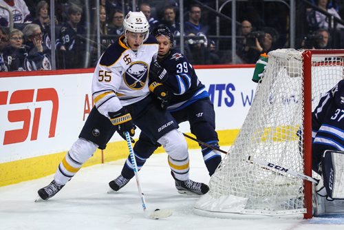 MIKE DEAL / WINNIPEG FREE PRESS
The Winnipeg Jets' Toby Enstrom (39) tries to knock Buffalo Sabres' defenceman Rasmus Ristolainen (#55) off the puck during NHL game action Sunday afternoon at the MTS Centre.
161030 - Sunday October 30, 2016