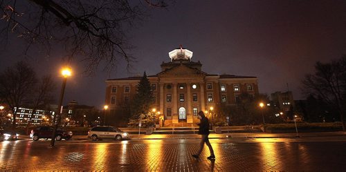 PHIL HOSSACK / WINNIPEG FREE PRESS - A student walks past the U of M Administration Building Monday evening as a strike deadline of Midnight looms over the facility. See story.  October 31, 2016