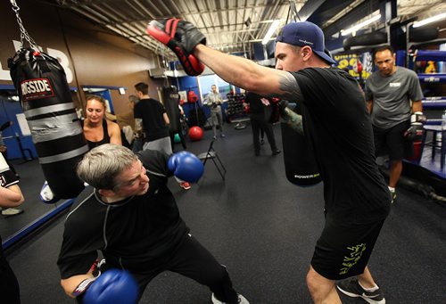 PHIL HOSSACK / WINNIPEG FREE PRESS -  Syd Weidman goes low before throwing a punch at Trainer and organizer Brandt Butt during a workout for "Counter Punch" a boxing program for Parkinson's patients.  See Jeff Hamilton's story.  November 1, 2016