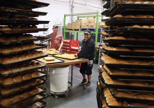 JASON HALSTEAD / WINNIPEG FREE PRESS

Employees Avelino Ordoñez and Lupita Miramontes work with buns at KUB Bakery on Erin Street in the West End on Nov. 2, 2016. KUB Bakery has been making Winnipeg-style Rye bread, using virtually the same recipe, since 1923. (See Sanderson The City story for Sunday, Nov. 6, 2016)