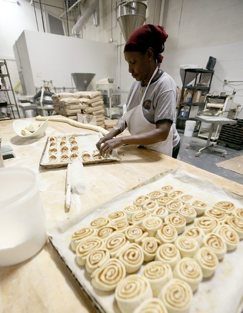JASON HALSTEAD / WINNIPEG FREE PRESS

Employee Rukia Wako works on cinnamon swirls at KUB Bakery on Erin Street in the West End on Nov. 2, 2016. KUB Bakery has been making Winnipeg-style Rye bread, using virtually the same recipe, since 1923. (See Sanderson The City story for Sunday, Nov. 6, 2016)