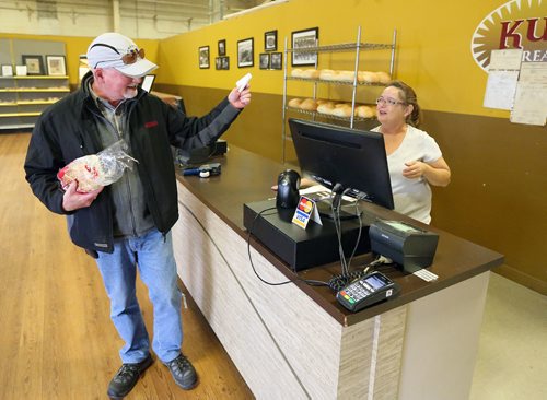 JASON HALSTEAD / WINNIPEG FREE PRESS

Regular customer Rick Duffin chats with retail employee Janet Parisien at KUB Bakery on Erin Street in the West End on Nov. 2, 2016. KUB Bakery has been making Winnipeg-style Rye bread, using virtually the same recipe, since 1923. (See Sanderson The City story for Sunday, Nov. 6, 2016)