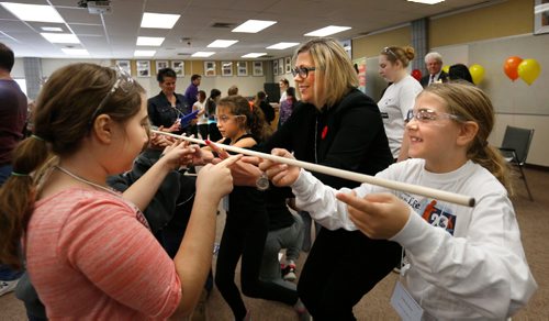 WAYNE GLOWACKI / WINNIPEG FREE PRESS





Rochelle Squires, Sport, Culture, Heritage and responsible for the status of women Minister participates in a team building stick game with Grade 5 students from right, Dakota Bear, Natalia Pangilinan both from Joseph Teres School and Chloe Rusnak from Wayoata Elementary School at left. The Minister was at Bernie Wolfe School Friday morning attending the Unlocking the Toolkit Girls Forum. Sixty-two grade 5 girls from the school division were invited to take part in workshops in the gym to get hands on experience in different trades including carpentry , plumber/pipe fitting and virtual reality game developing. see release Nov. 4 2016
