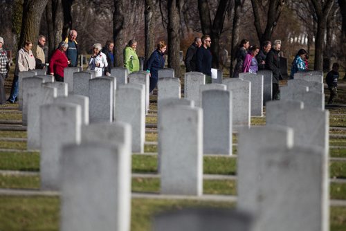 MIKE DEAL / WINNIPEG FREE PRESS
People walk amongst the graves of fallen soldiers in the Brookside Cemetery Field of Honour Sunday morning. The cemetery held a tour and remembrance service to honour the more than 11,000 war veterans interred there.
161106 - Sunday November 6, 2016
