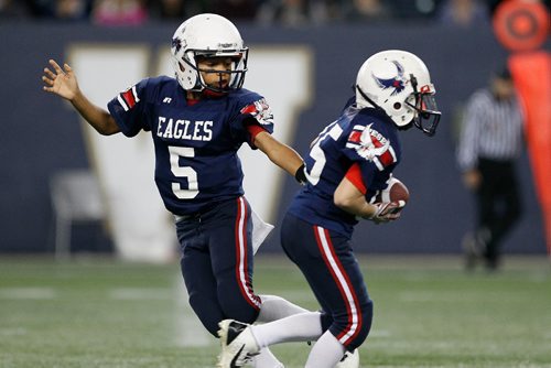 JOHN WOODS / WINNIPEG FREE PRESS
East Side Eagles' Vincent Lyle (5) hands off to Brett Gascoigne (15) against the St Vital Mustangs in the Football Manitoba Peewee Championship game Sunday, November 6, 2016. 

