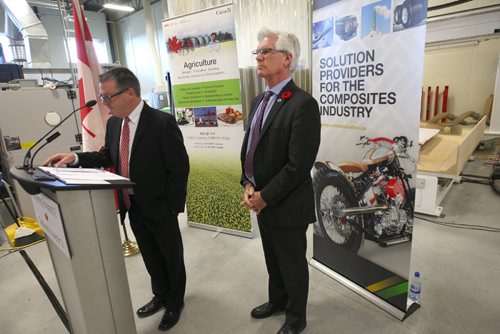JOE BRYKSA / WINNIPEG FREE PRESS  Composites Innovation Centre- 158 Commerce Drive-Minister of Natural Resources, Jim Carr, right, on behalf of the Minister of Agriculture and Agri-Food, Lawrence MacAulay, announced two innovative projects that will provide assurances for quality Canadian biomass and innovative applications for biocomposites- Carr behind Sean McKay the President and CEO of the Composites Innovation Centre as he indruduces him to visitors-Nov 07, 2016 -( See Martin Cash story)