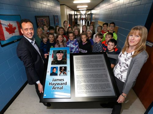 

WAYNE GLOWACKI / WINNIPEG FREE PRESS






Ecole Howden Principal Ron Cadez and teacher Michelle Follows hold  a plaque that will be placed on a wall in the hall in honour of Cpl. James Arnal, a former student killed eight years ago in Afghanistan.  In back is Kristyn Artibises grade 6 class that is  studying about  Cpl. James Arnal in their social studies class.  Gord Sinclair story Nov. 7 2016