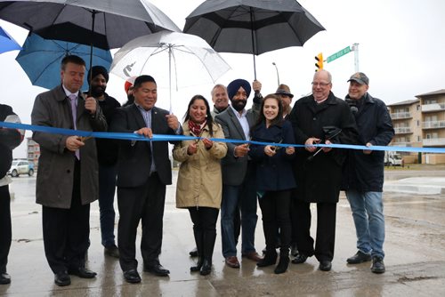 Canstar Community News Front row left to right: Paulo Cabral, Coun. Mike Pagtakhan, Coun. Devi Sharma, MLA Cindy Lamoureux and Meadows West School Principal Roger LeGrand cut the ribbon at Keewatin Street and Dr. Jose Rizal Way on Oct. 31.