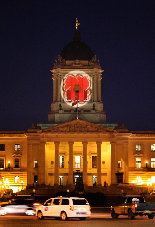 PHIL HOSSACK / WINNIPEG FREE PRESS - A Rememberance Day Poppy made it's appearance projected onto the top of Manitoba's Legislature Monday evening. STAND-UP  November 7, 2016